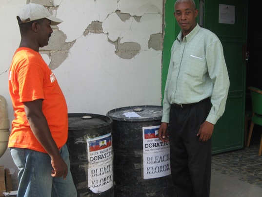 November 22, 2010. Mr. Allain Demesier from Haiti Relief Fund and Mr. Zilien Andrice, magasinier of the Hospital L'Universite D'Etat D'Haiti Port-au-Prince Haiti. The Hospital was in need of bleach to help fighting Cholera, and Haiti Relief Fund is looking to bleach Cholera out of Haiti.